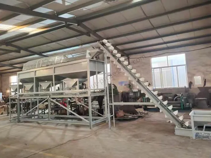 Feeding elevator and rotary drum grading machine for nut processing line